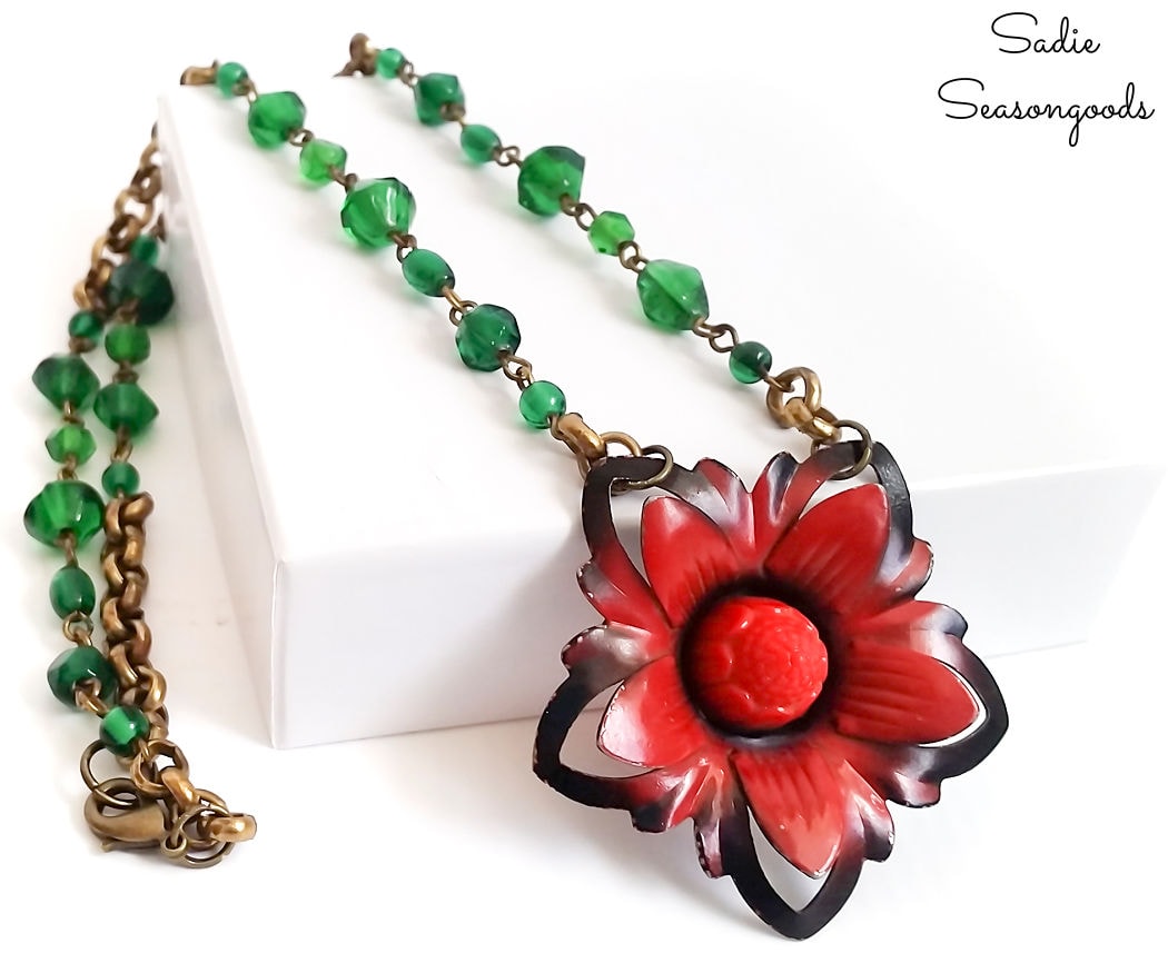 poinsettia necklace with a glass bead chain