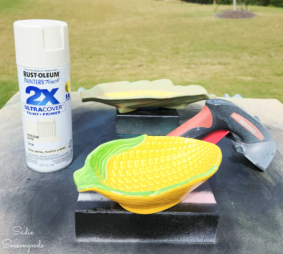 spary painting a base coat on a corn bowl