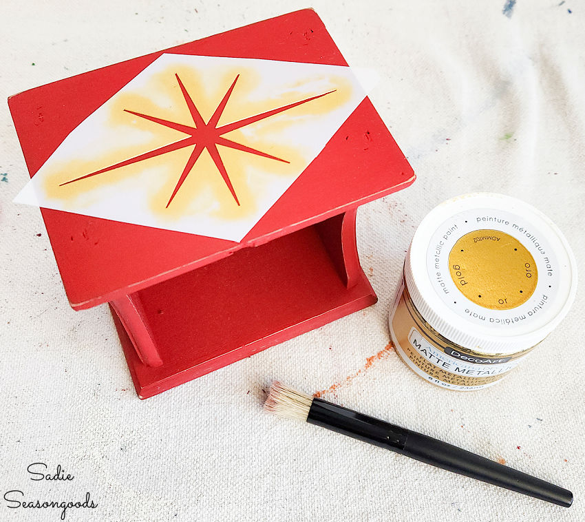 christmas star stencil on a wooden coaster holder