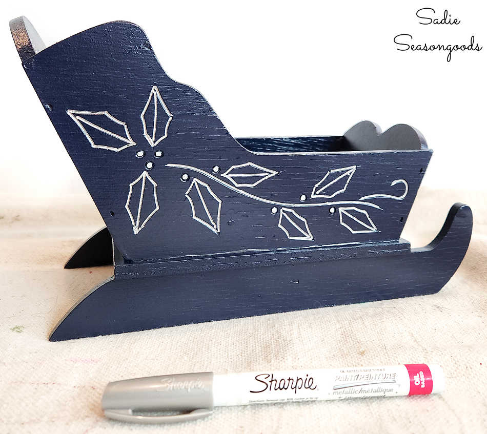 january decorations in blue and silver winter makeover on a wooden sleigh