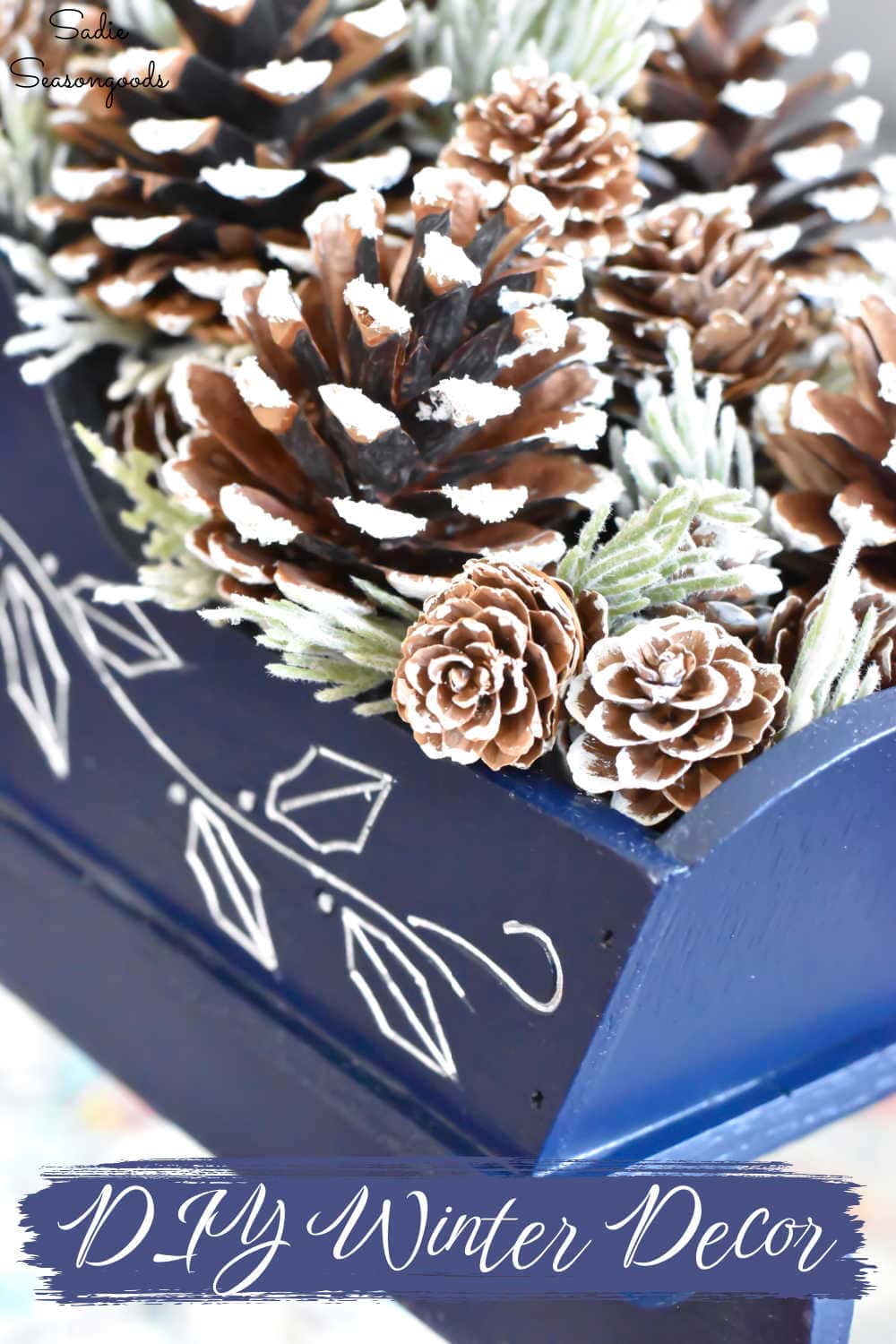 snow-covered pine cones and winter greenery for winter decor