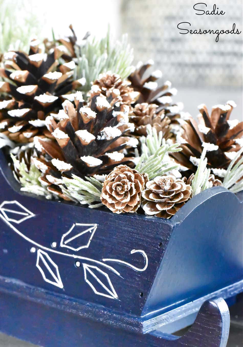 january decorations with pine cones and winter greenery