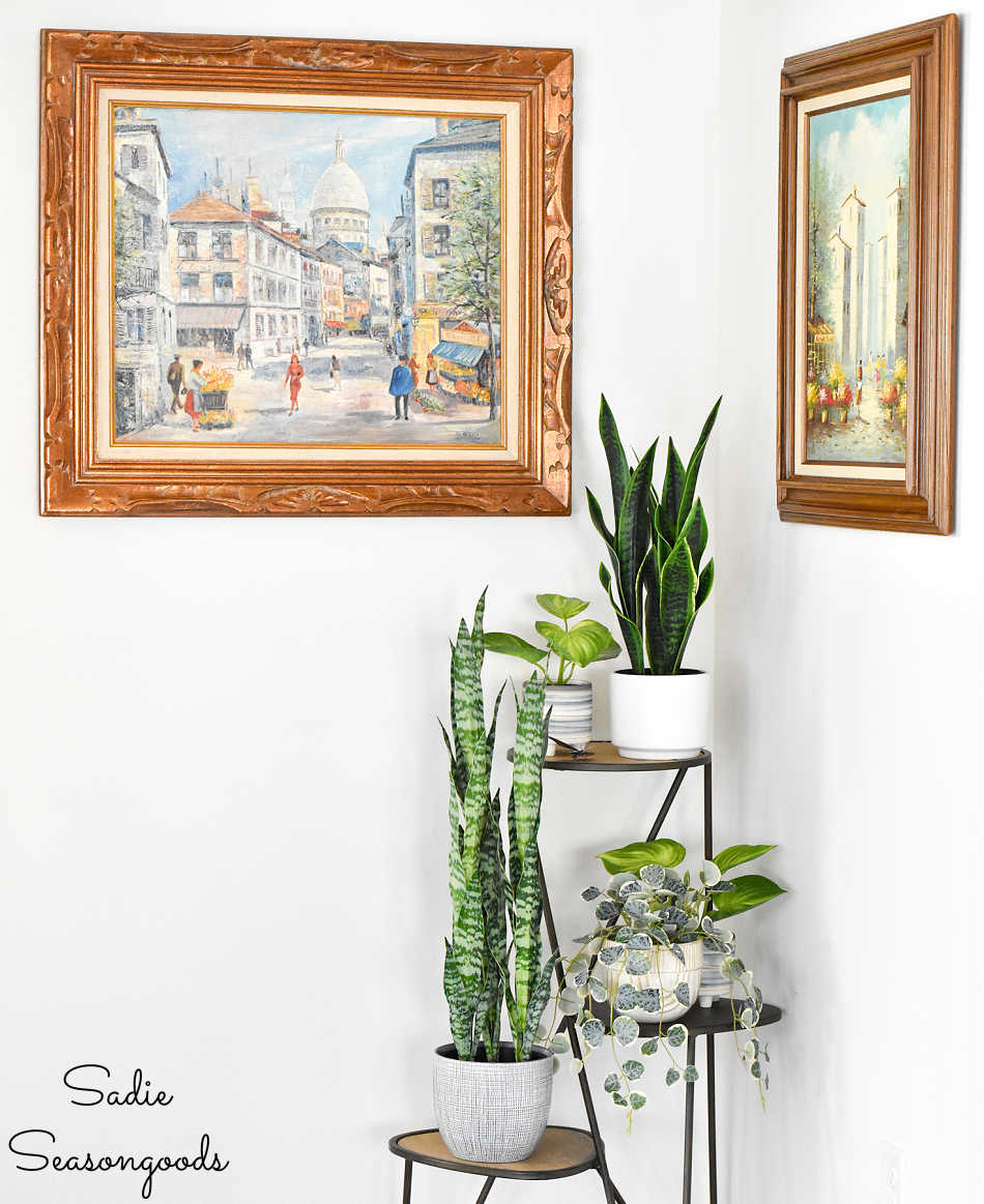 decor and thrift store art in alcove outside the primary bedroom