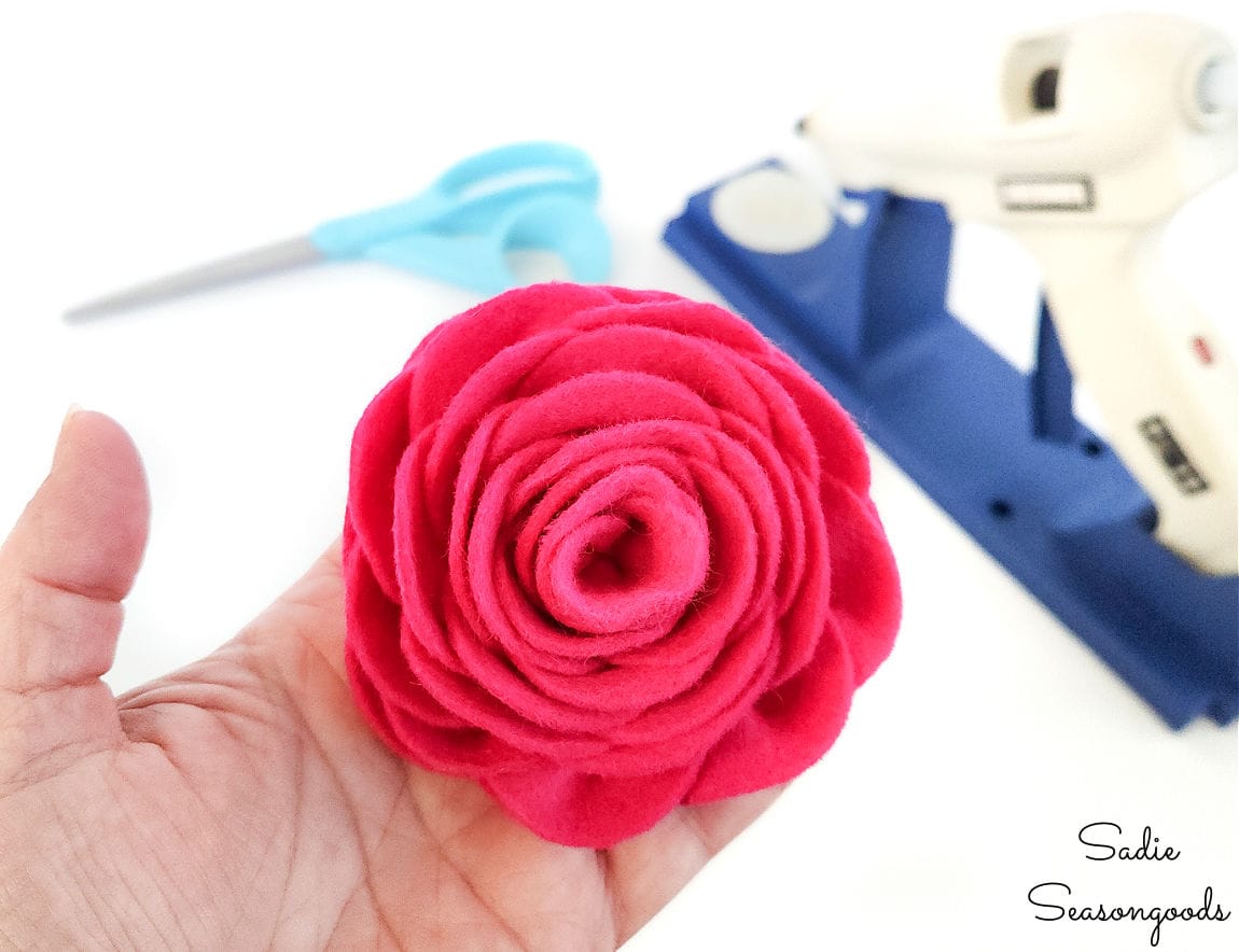 a felt rose to attach to a valentine's day pillow