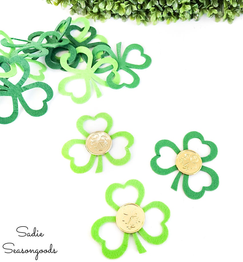 decorating the felt shamrocks with gold coins