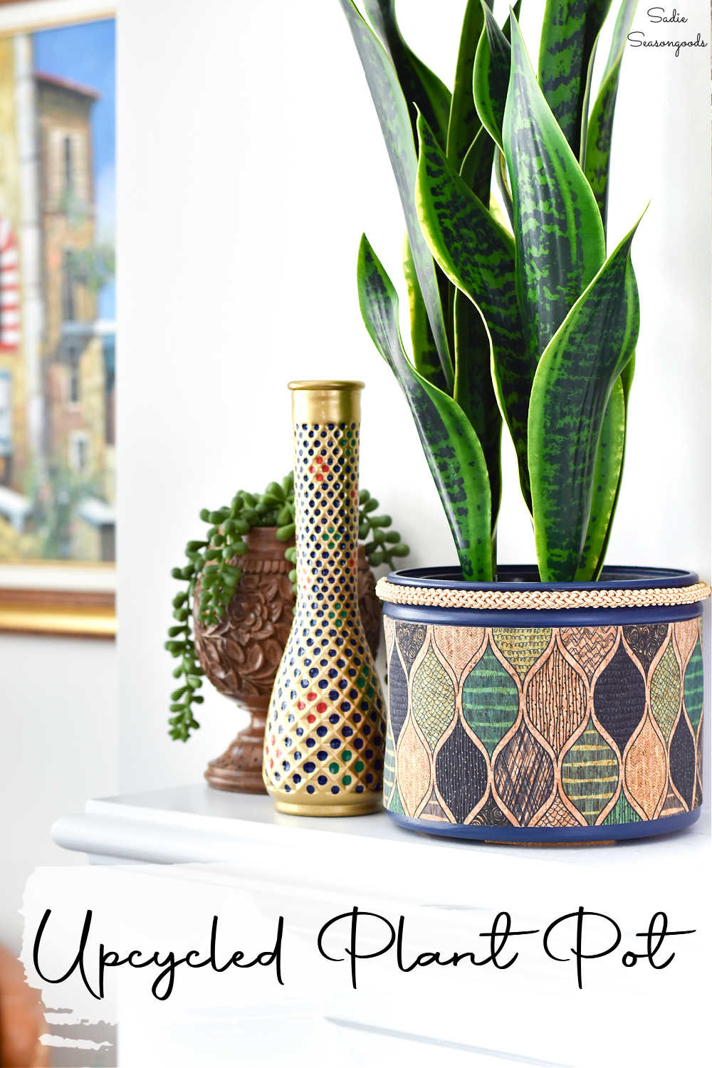repurposing a plastic coffee can into a planter for a faux snake plant