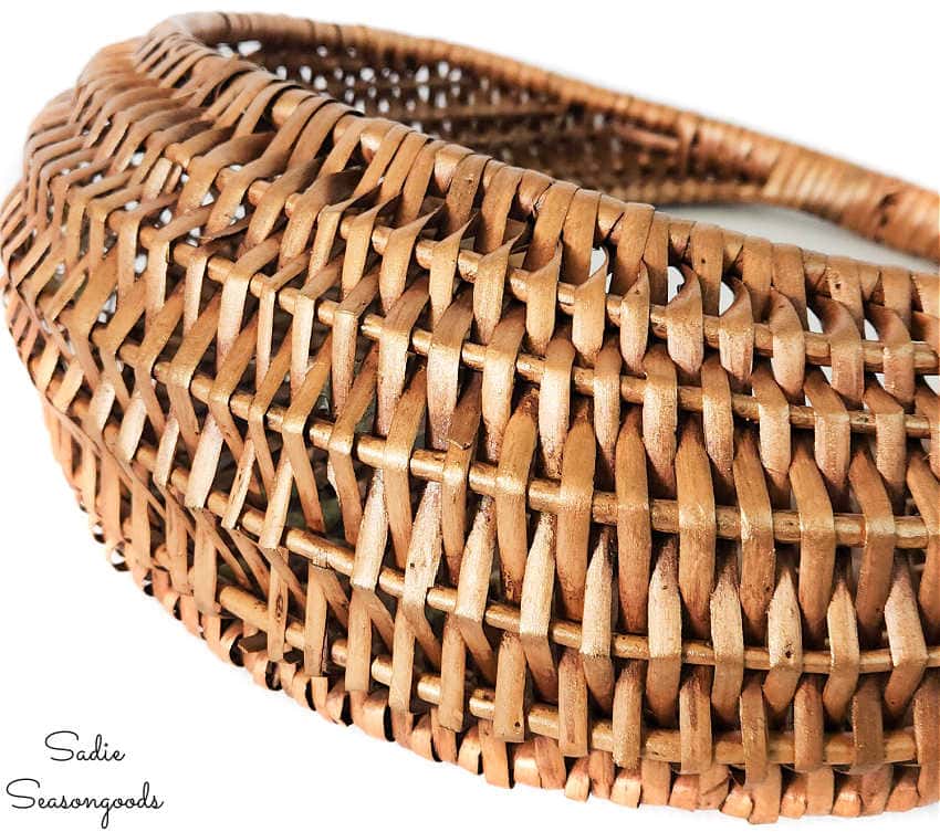 gold glaze on a round basket wicker wall pocket that has been glazed