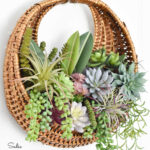 wall basket with fake succulents