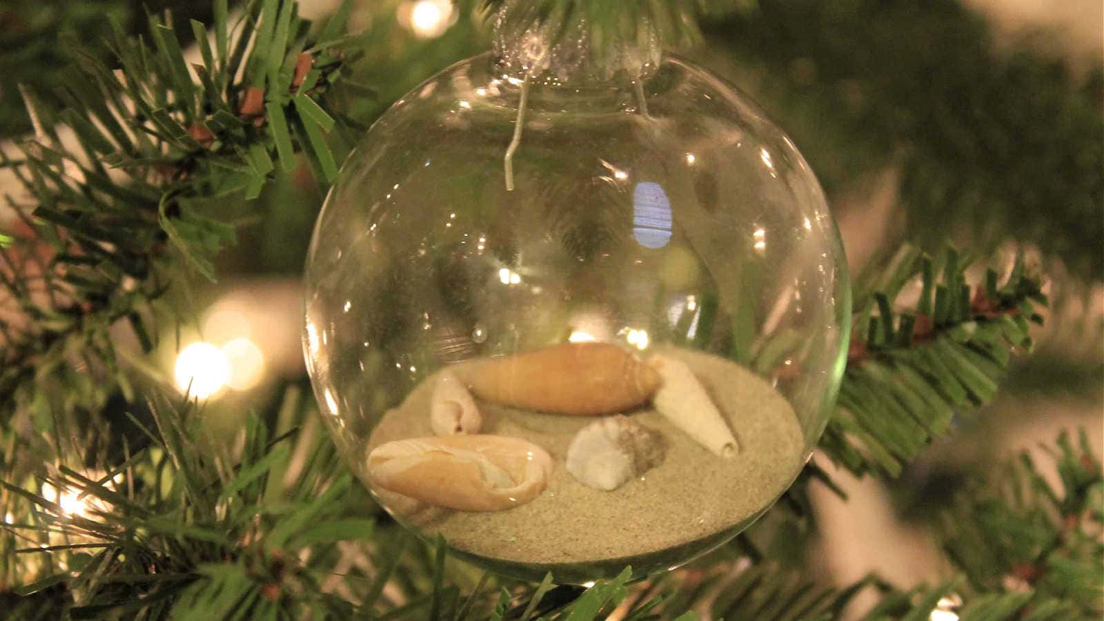 adding sand and shells to an ornament