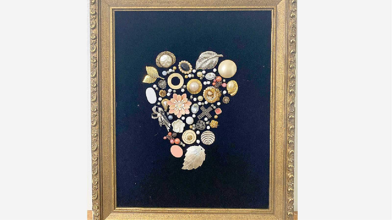 framed collage from vintage jewelry
