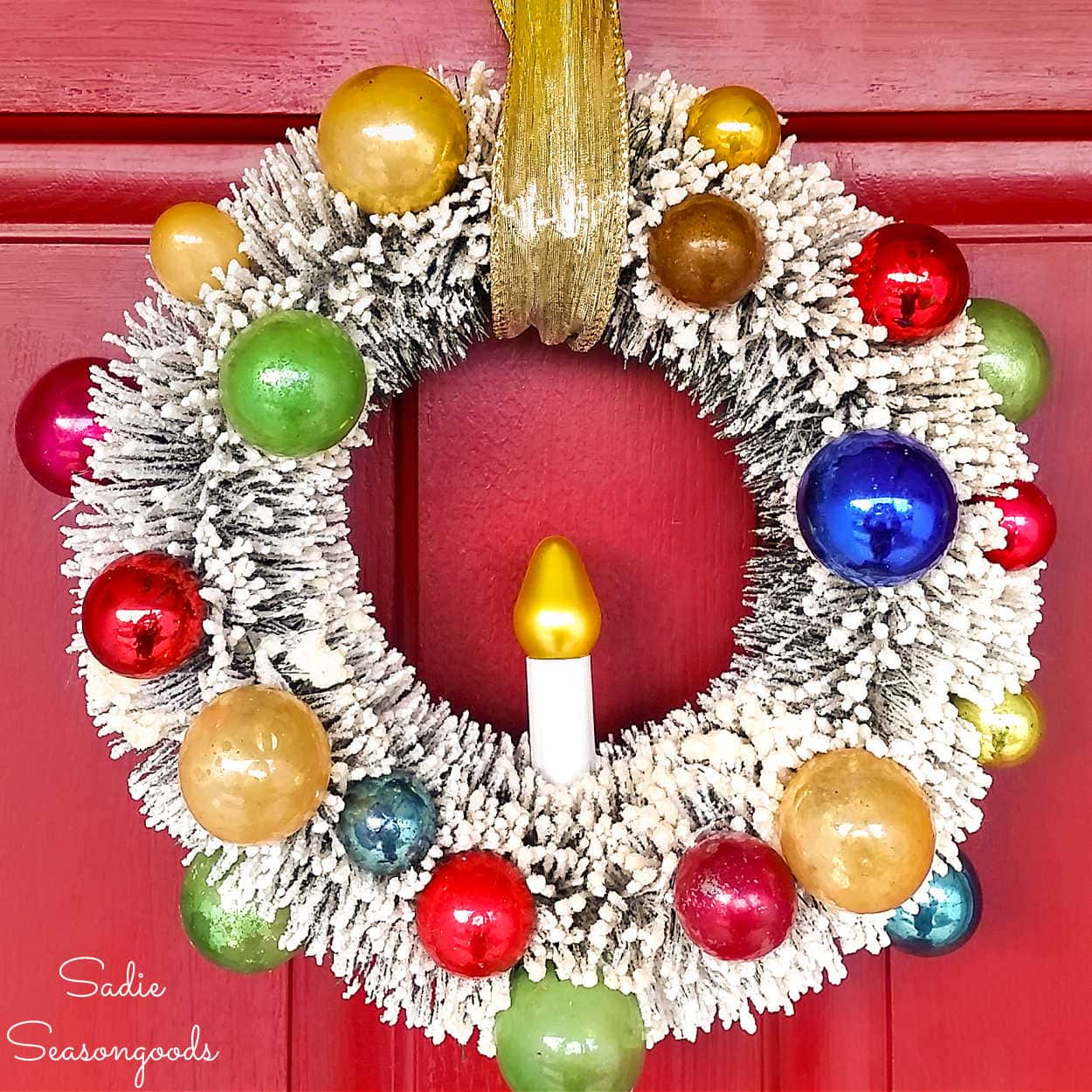 vintage bottlebrush wreath that has been decorated with vintage ornaments