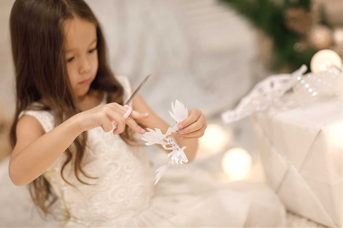 making paper snowflakes for christmas party