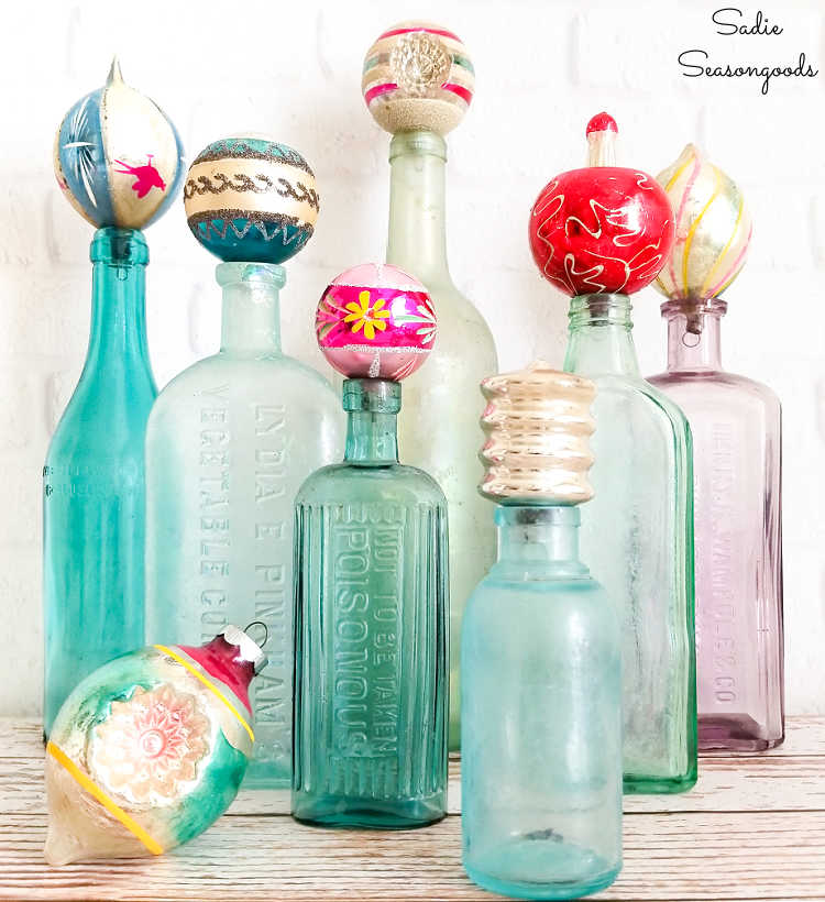 decorating for christmas with vintage ornaments and antique bottles