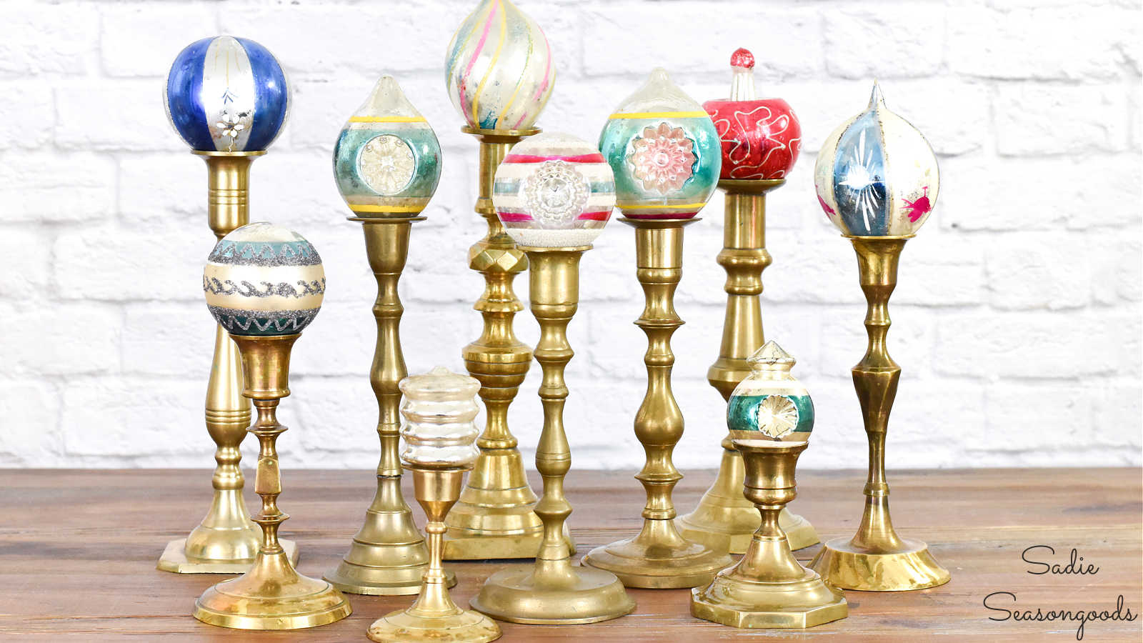 vintage brass candlesticks as a christmas ornament display