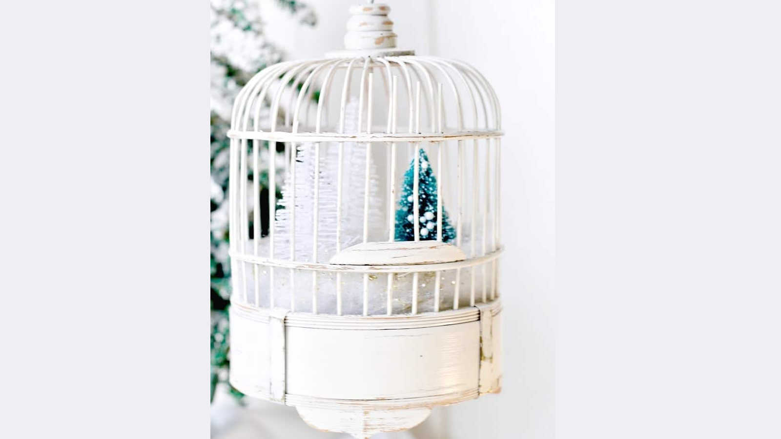 snow scene in a bamboo bird cage