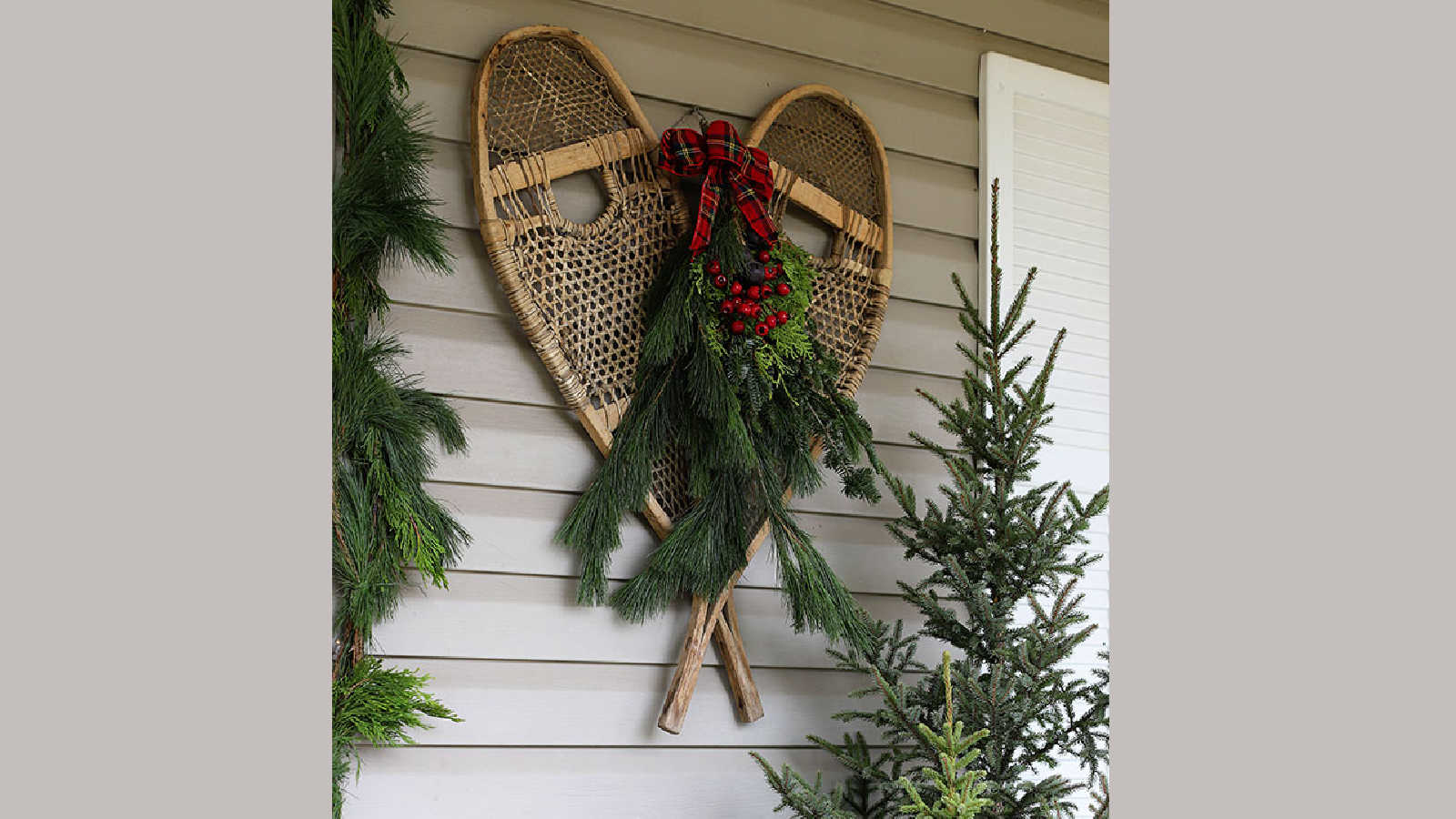 snow shoes on a christmas porch