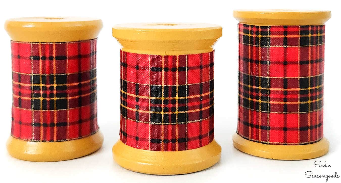 wooden spools that look like mini plaid coolers