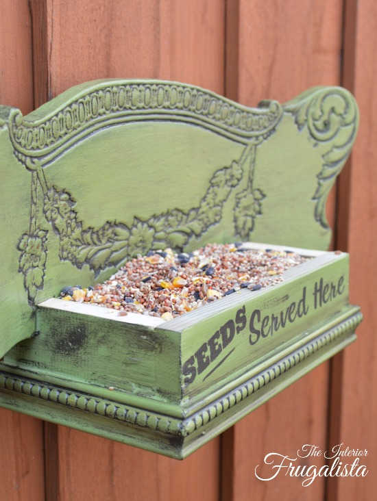upcycled chair as a bird feeder for backyard birds