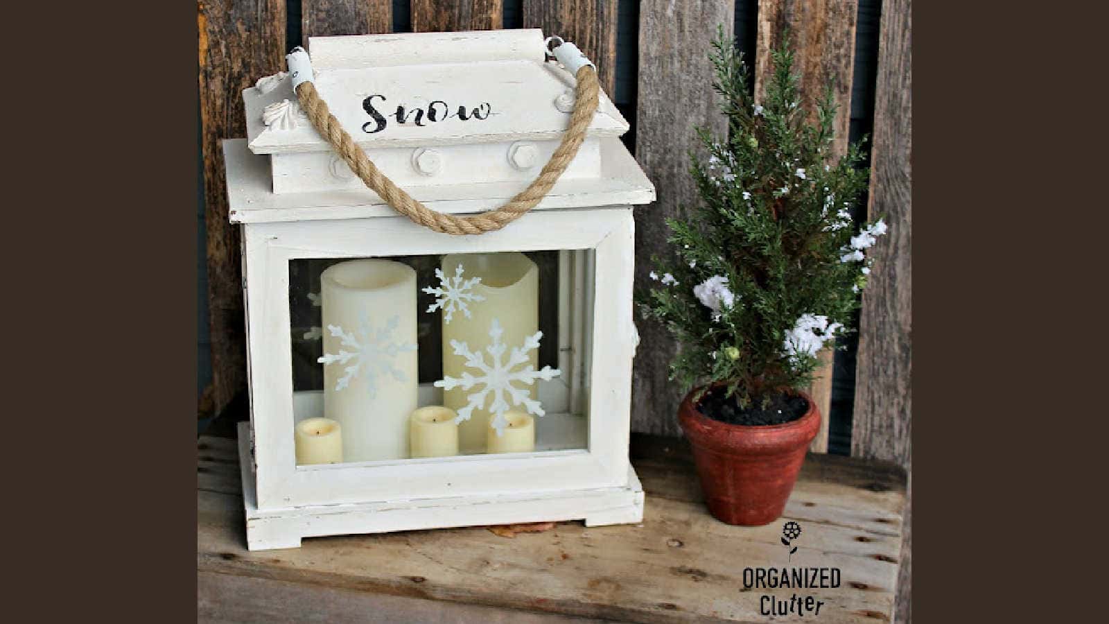 stenciling a lantern with snowflakes