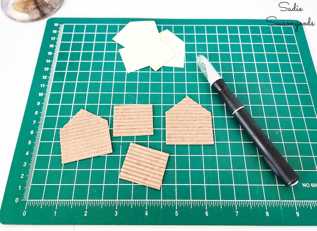 cutting out the pieces of a diy putz house