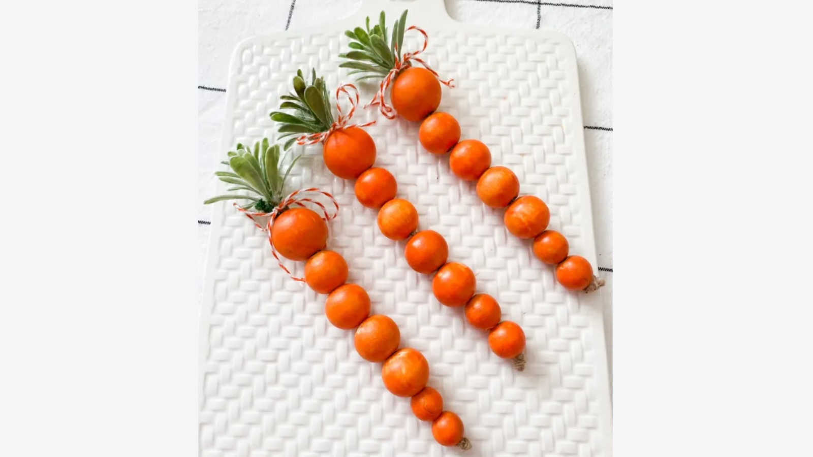 decorative easter carrots with wooden beads