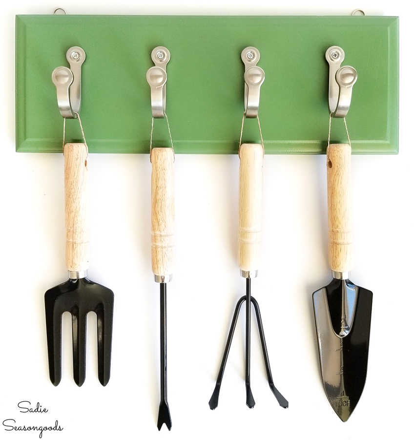 garden tool hanger from a small cabinet door