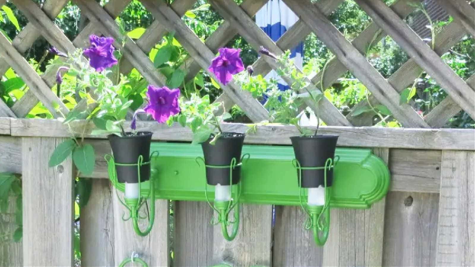 bathroom light fixture as fence decor