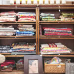 stacks of vintage fabric at a vintage shop