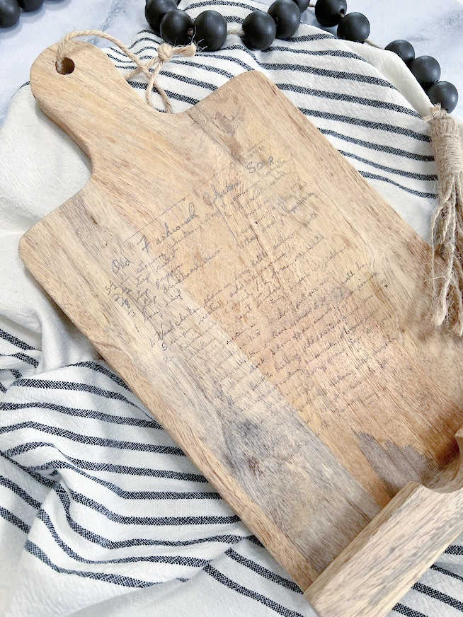 transfer a recipe card on a wood cutting board