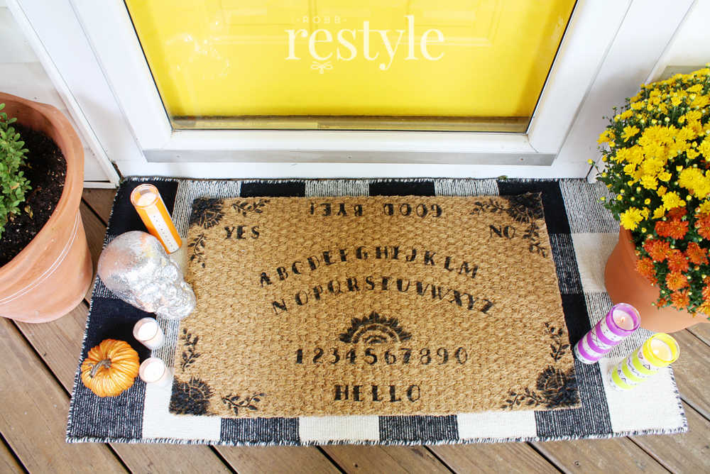 decorating a welcome mat like a ouija board