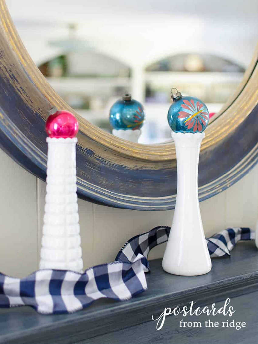 vintage milk glass vases topped with glass ornaments