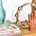 boho decor on a bamboo bookshelf