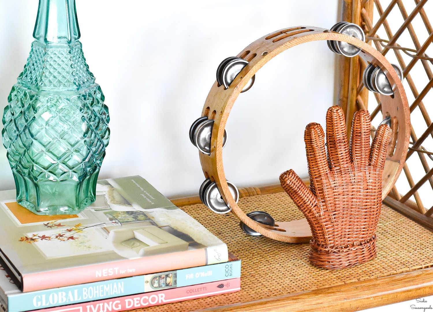 boho decor on a bamboo bookshelf
