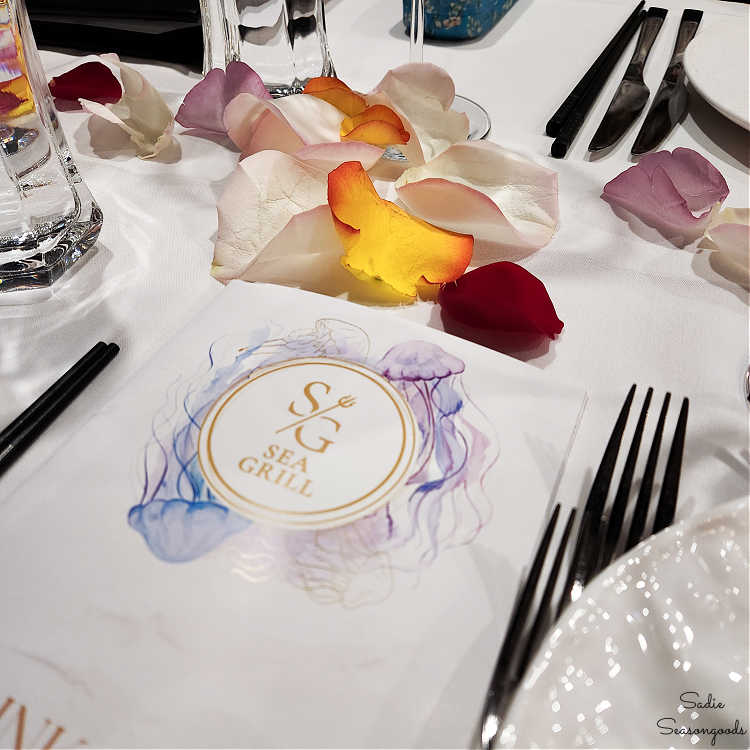 dinner table covered in rose petals