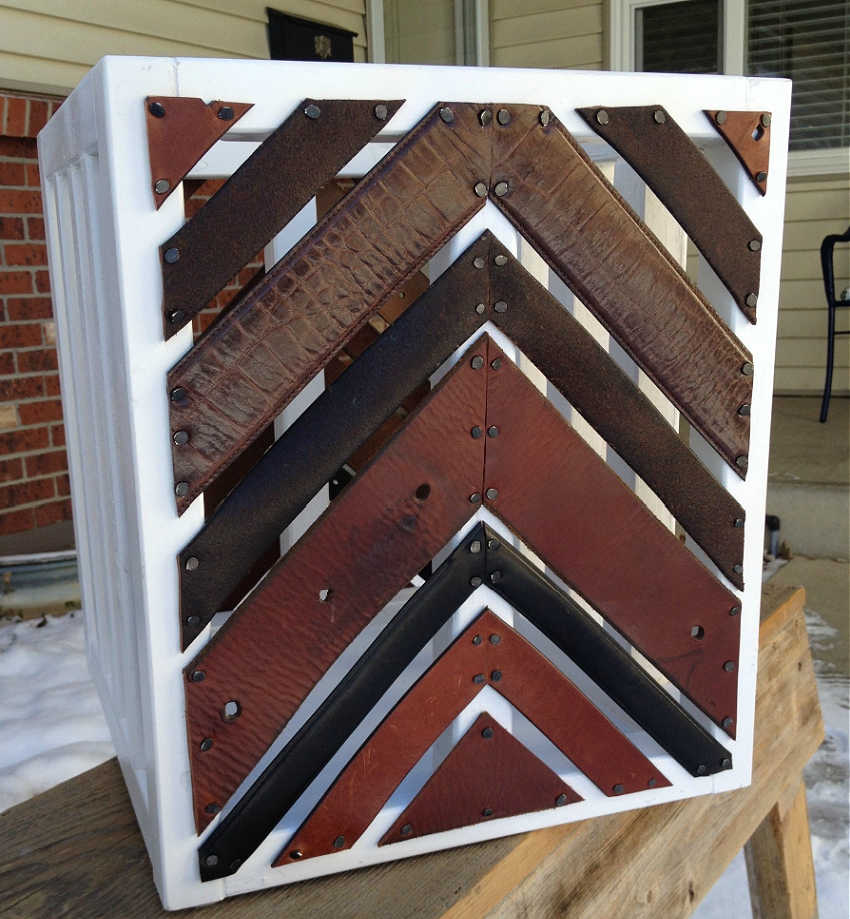 decorating a crate with belts