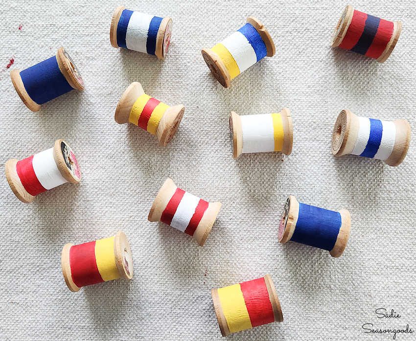 vintage wooden spools that look like nautical buoys