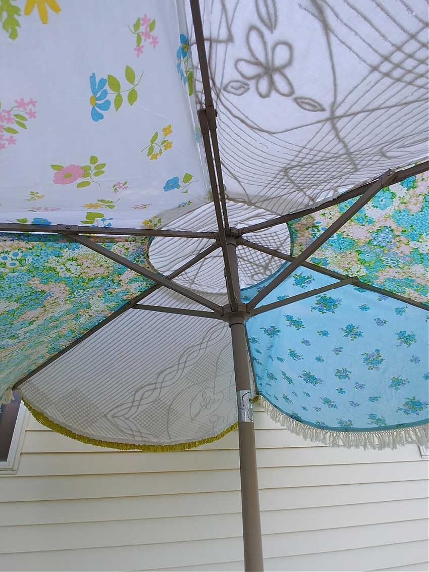 upcycling a patio umbrella with vintage sheets