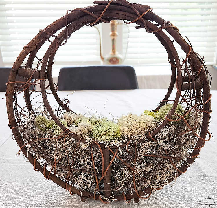 woodland halloween decor in a grapevine basket