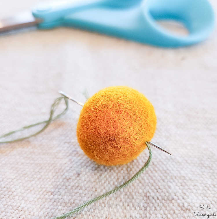 stitching on pumpkin ridges with embroidery floss