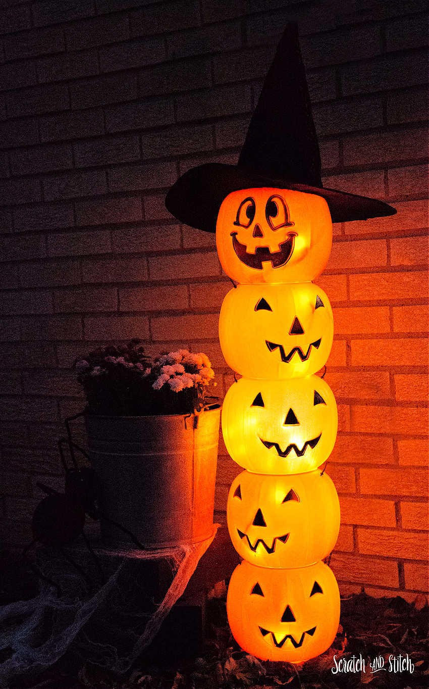 jack-o-lantern totem with plastic pumpkins