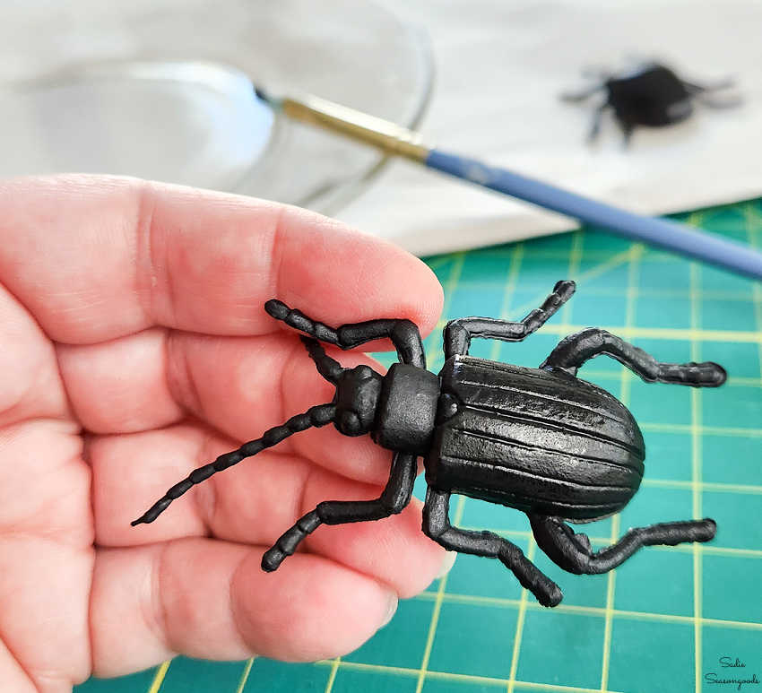 plastic beetle with black paint