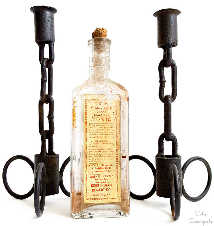 antique iron candlesticks