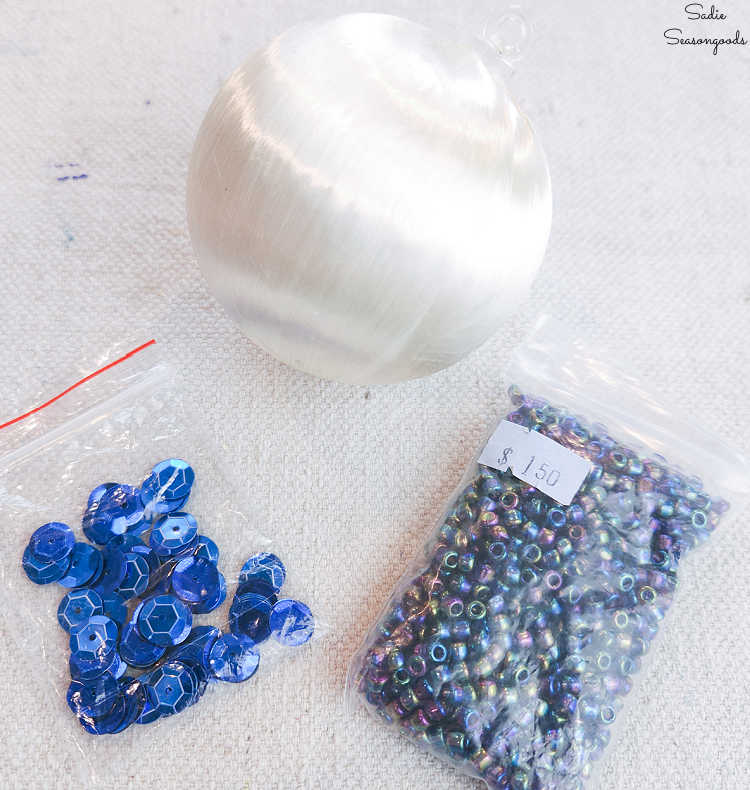 making a beaded christmas ornament with supplies from a creative reuse center