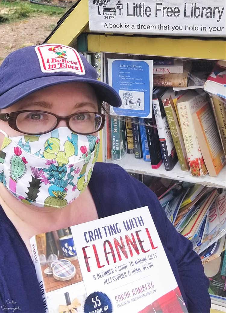 adding my book to a little free library