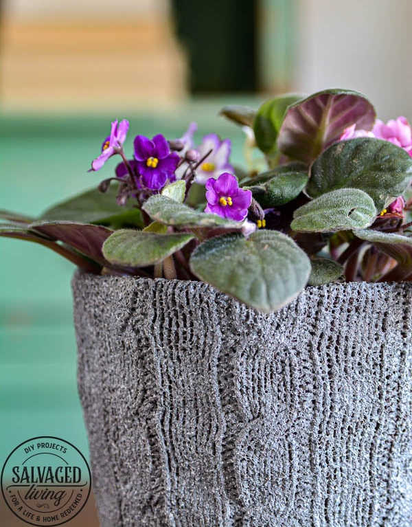 covering a flower pot with a painted sweater