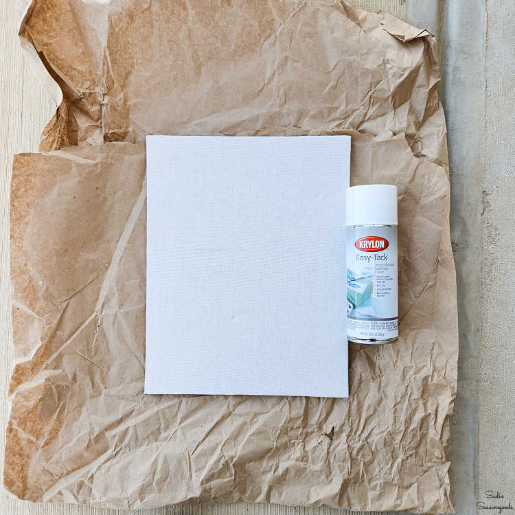 decorating the back of the shadow box with fabric