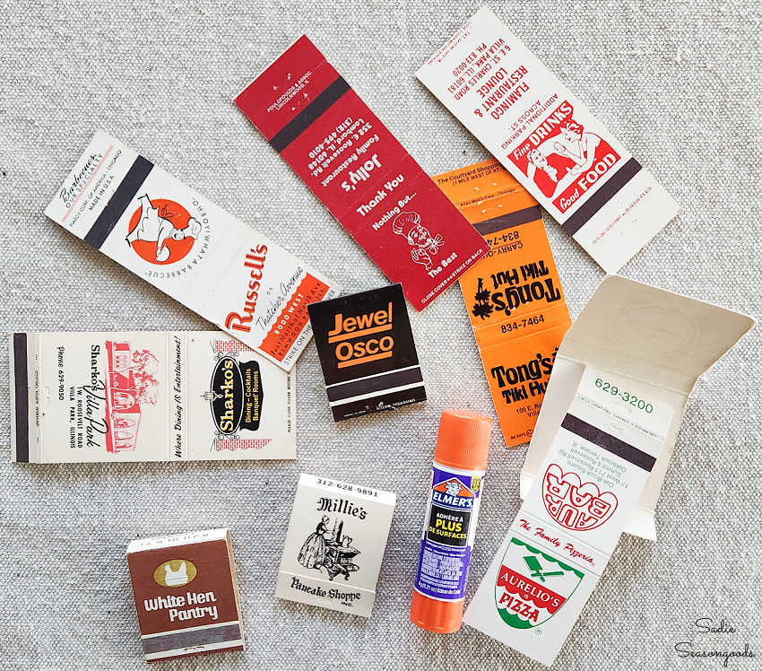 using a glue stick to close matchbooks for a shadow box