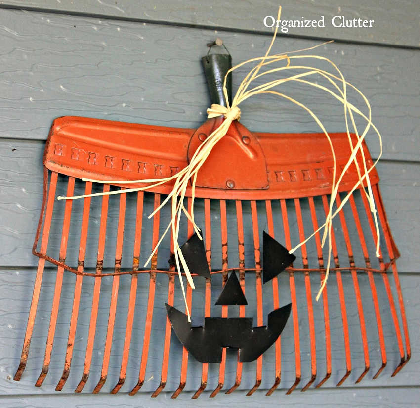 orange rake head as a jack-o-lantern