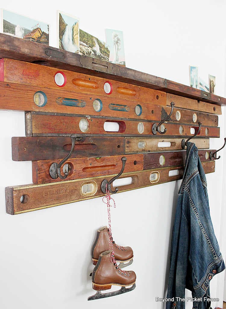 vintage wooden levels as diy coat hooks
