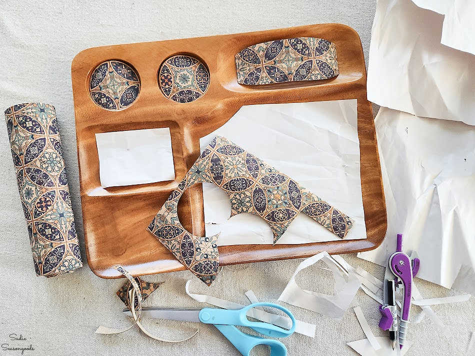 cutting out cork fabric inserts for a jewelry tray